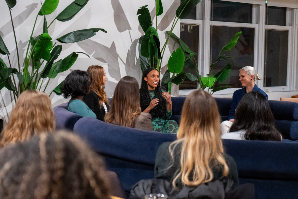 Women connecting at a Her Workplace corporate event
